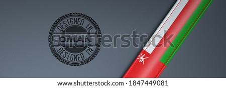 Designed in Oman stamp & Omani flag.