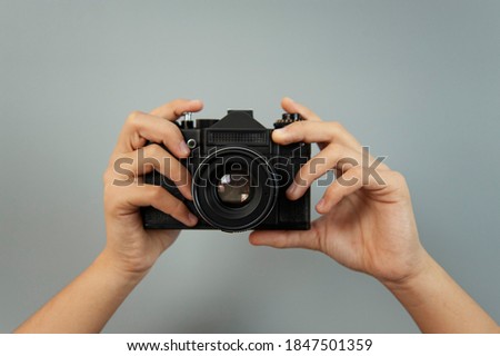 photo camera in the hands of a girl Royalty-Free Stock Photo #1847501359