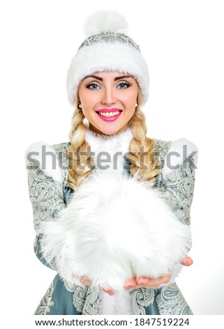 Lovely smiling Snow Maiden. Woman dressed in traditional russian christmas costume of Snegurochka (Snow Maiden)