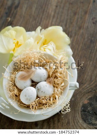 Chocolate Easter eggs in white cup, selective focus