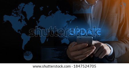 Businessman holding a smartphone with inscription UPDATE .background at night,concept futuristic Business, Technology, Internet and network concept.