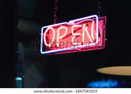 neon sign "open" in the cafe