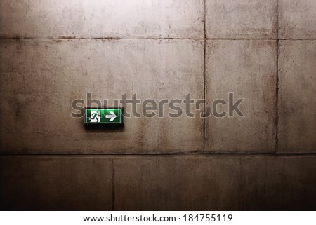 green exit sign on the wall