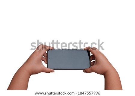 Close-up photo, the hand gesture of the person holding and watching the mobile screen.  On a white background.isolated