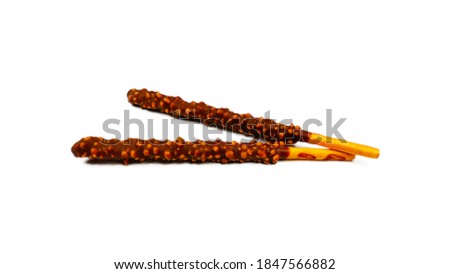 Close up of a Crunchy Pepero Chocolate Stick Encrusted with Almonds. Isolated on white background. For Pepero Day, a day for gifts to loved ones.