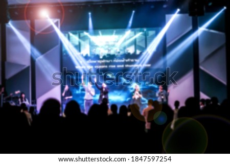 Picture blur effect and lens flare. Concert in low light .