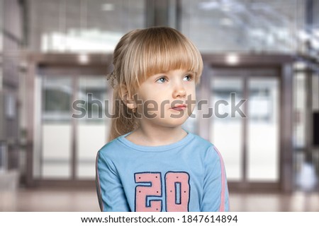 Portrait of serious sad little child, volunteer concept Royalty-Free Stock Photo #1847614894