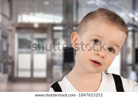 Portrait of serious sad little child, volunteer concept Royalty-Free Stock Photo #1847615251