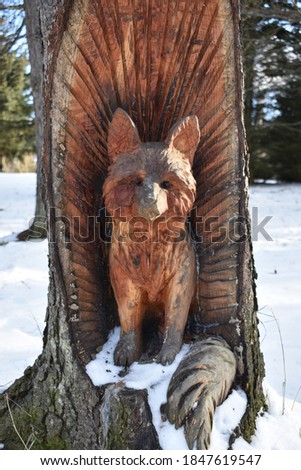 Wood carving of a fox