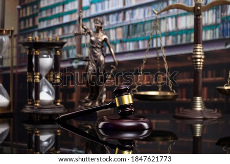 Legal concept. Law and justice symbols on library background.