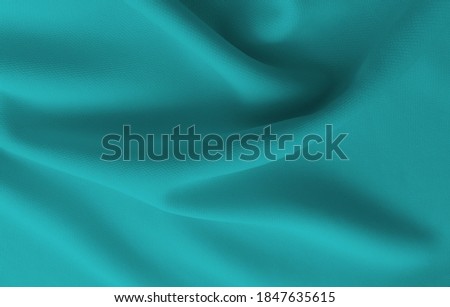 Abstract rippled greenish blue clothes background . Royalty-Free Stock Photo #1847635615
