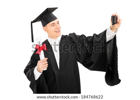 College graduate taking a selfie with cell phone holding a diploma isolated on white background