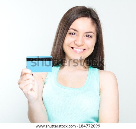 Happy business woman holding credit card
