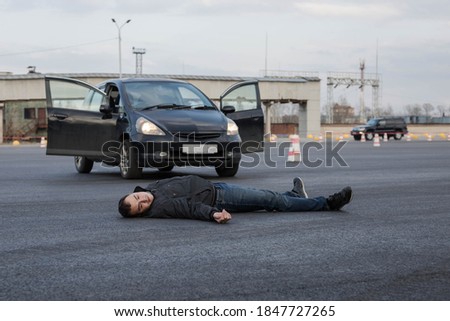 Traffic accident with fatal outcome. A man was hit by a car and killed. A car hit a man. Excess of speed. Loss of consciousness Royalty-Free Stock Photo #1847727265