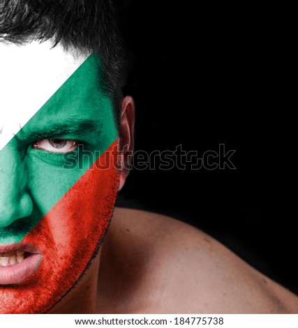 Portrait of angry man with painted flag of Bulgaria