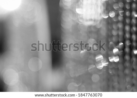 Christmas and New Year background. Glowing Holiday Abstract Defocused Background With Snowflakes and Stars. Blurred Bokeh