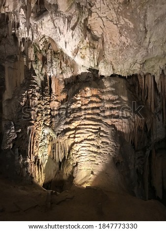 Stalactite and stalagmite of Postojna Cave in Slovenia.