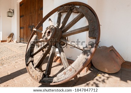 Carriage wheel in a traditional house at Santa Cruz town in Colchagua valley in Chile