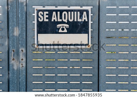 Poster to be rented on a metal door. Poster written in Spanish language
