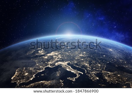 Planet Earth viewed from space with city lights in Europe. World with sunrise. Conceptual image for global business or European communication technology, elements from NASA Royalty-Free Stock Photo #1847866900