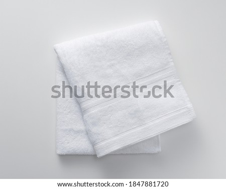 A white towel on a white background. View from above Royalty-Free Stock Photo #1847881720