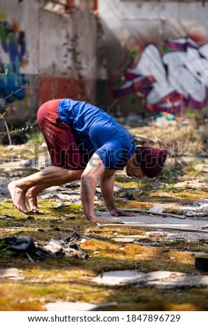 Handsome Man Standing on Hands Strong and Keeping Balance in Warehouse - Muscular Athletic Bodybuilder Fitness Model Doing Handstand Push-up