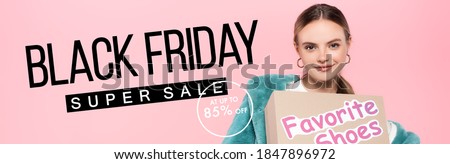 stylish woman in sunglasses holding box with favorite shoes near black friday super sale lettering on pink, banner