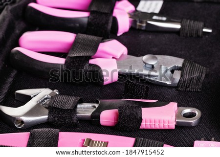 Home master's toolkit with pink handles