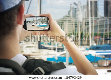 tourist taking photos  with mobile phone 