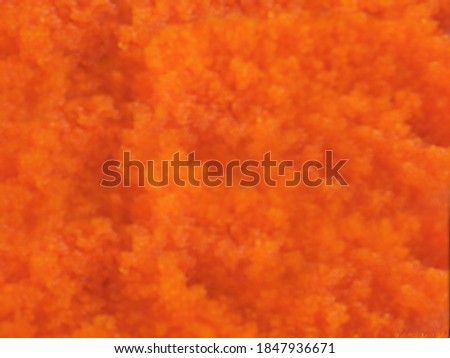 Abstract background​ texture​ of Blurred orange​ from small eggs shrimp picture with selective focus on 