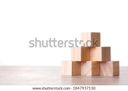 Wall Wooden Block Cubic On white Background. Wooden Block on table with Copy Space.