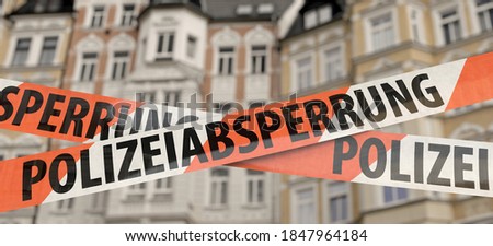 Barrier tape with the German word "Polizeiabsperrung" (police barrier)