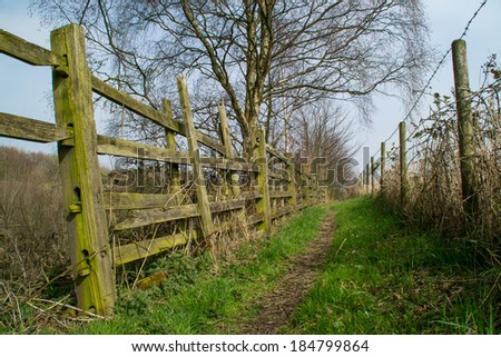 Foot path leading through rural Northwest English countryside.