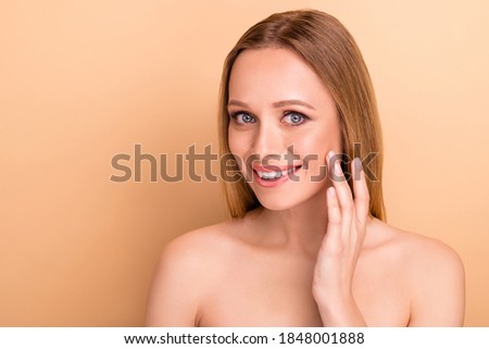 Close-up portrait of her she nice-looking attractive cheerful straight-haired girl applying moisturizing nourishing effective cream pure smooth soft clean clear skin isolated over beige background Royalty-Free Stock Photo #1848001888