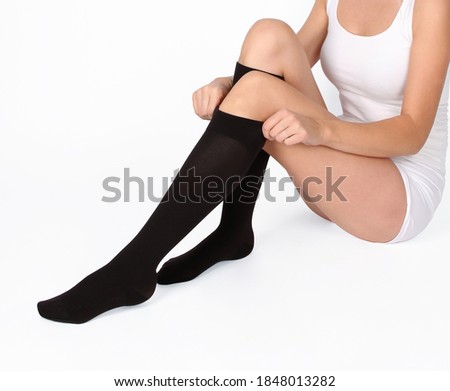 Compression Hosiery. Medical Compression stockings and tights for varicose veins and venouse therapy. Tights for man and women. Clinical compression knits. Comfort maternity tights for pregnant women. Royalty-Free Stock Photo #1848013282