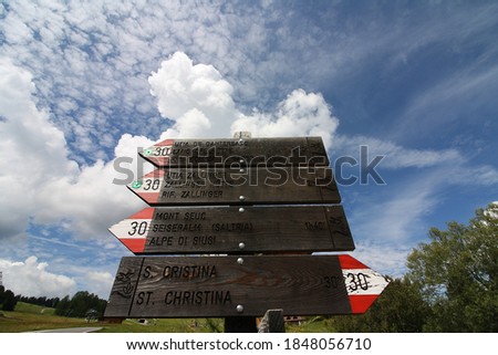 Wooden signposts on the Dolomite paths