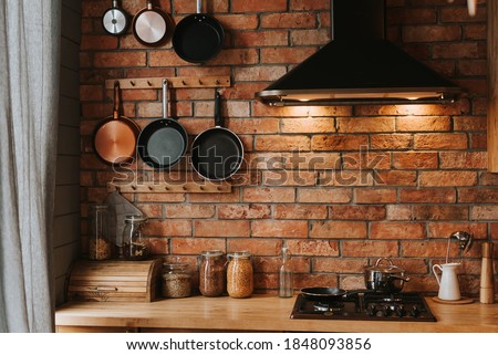 details of a cozy kitchen interior with a brick wall Royalty-Free Stock Photo #1848093856