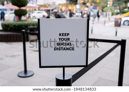 At the entrance of the shopping center with the barricade social distance warning board Royalty-Free Stock Photo #1848134833