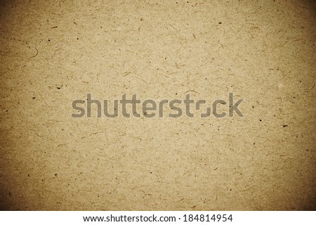 Textured aged cardboard as background.