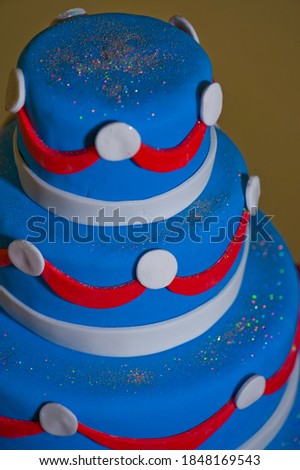 Birthday cake. Classic American dessert made with layers of vanilla and chocolate cake and frosted with sugar icing and fondant.