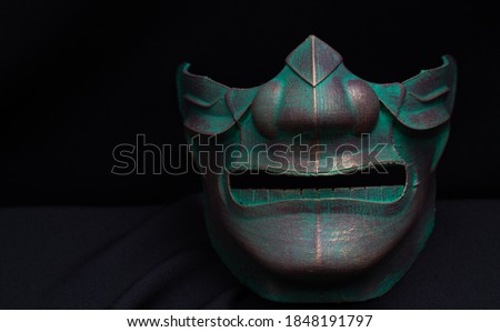 samurai mask with a black background Royalty-Free Stock Photo #1848191797
