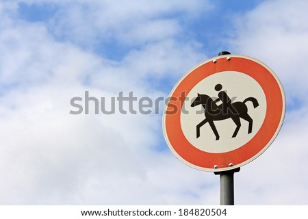 Traffic sign : Horse riding is prohibited, on the sky background