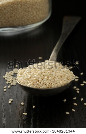 White Sesame seeds on a spoon