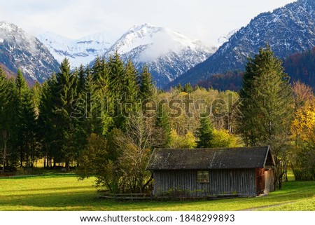 The nature and a house in Allgaeu Alps during autumn