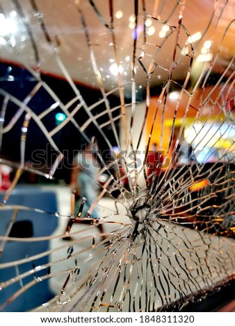Blurr image of a crack glass with blurry and bokeh effect at background. Crack windsheild problem. Transportation category. 