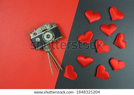  flat lay  vintage retro camera and red hearts  , valentine day concept         