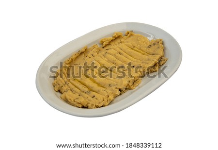 A closeup of a traditional Turkish and Greek appetizer meze Fava isolated on a white background