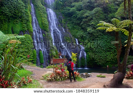 Landscape Photo People with red shirt stand on the side of Banyumala Twin Waterfall Bali Indonesia Fresh Green 