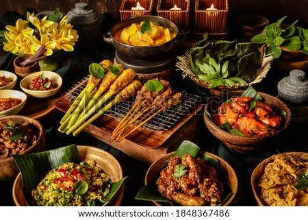 Festive Balinese Rijsttafel with Traditional Dishes Royalty-Free Stock Photo #1848367486
