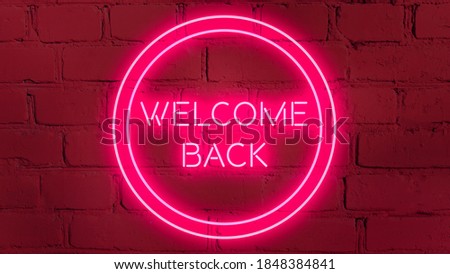 WELCOME BACK phrase in pink neon style on  pink brick background for your design tempates.